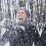 happy-young-woman-enjoying-snowfall-winter-forest - ТРК Щелково